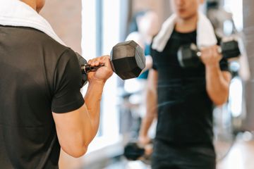 A young man doing exercise to lose weight A man is doing sports to lose weight