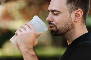 A man is having a protein shake for weight loss and changing body composition A man is having a protein shake to lose weight and gain muscles